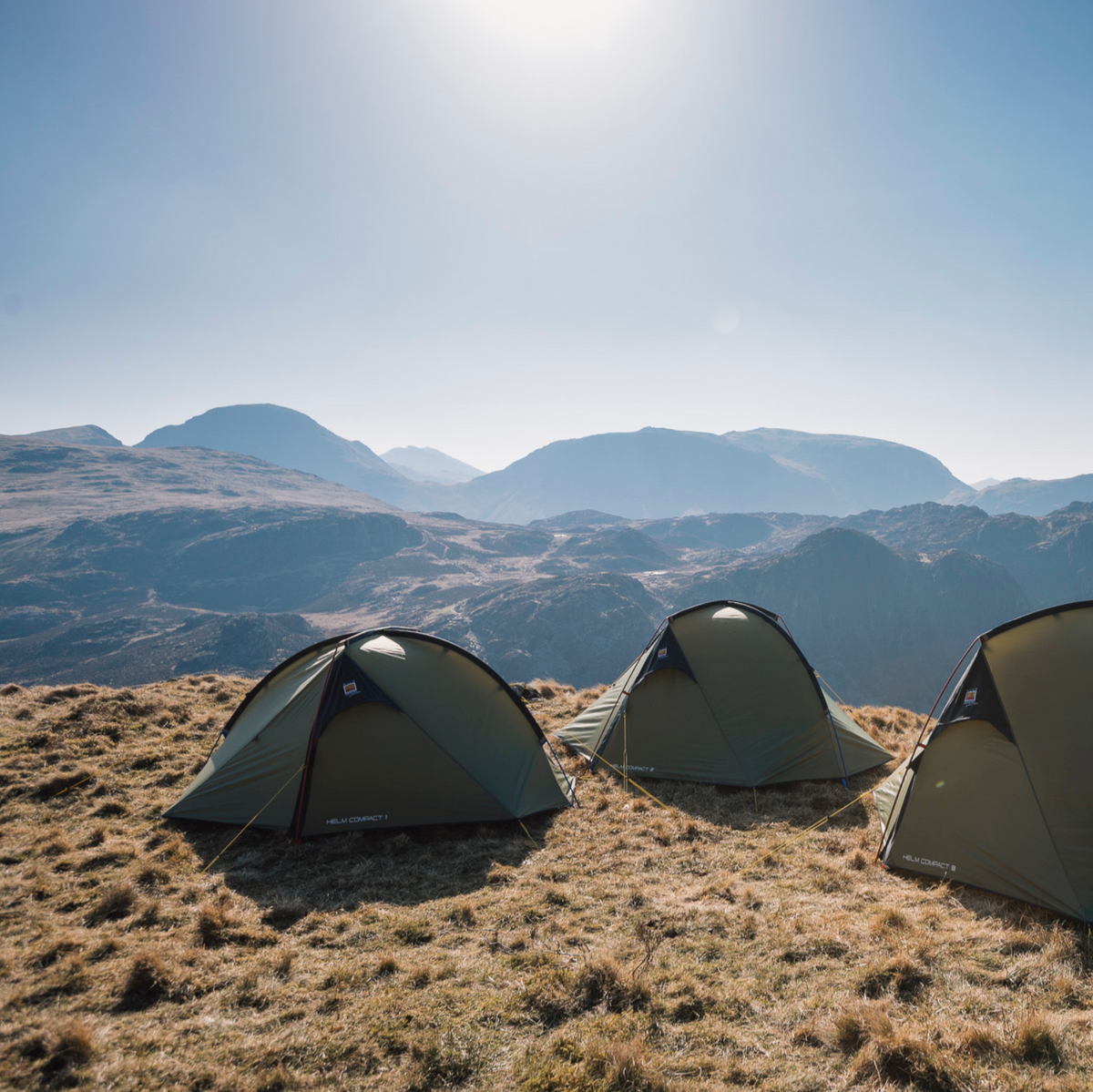 A Wild Country Helm Compact 1 Tent pitched on the side of a mountain